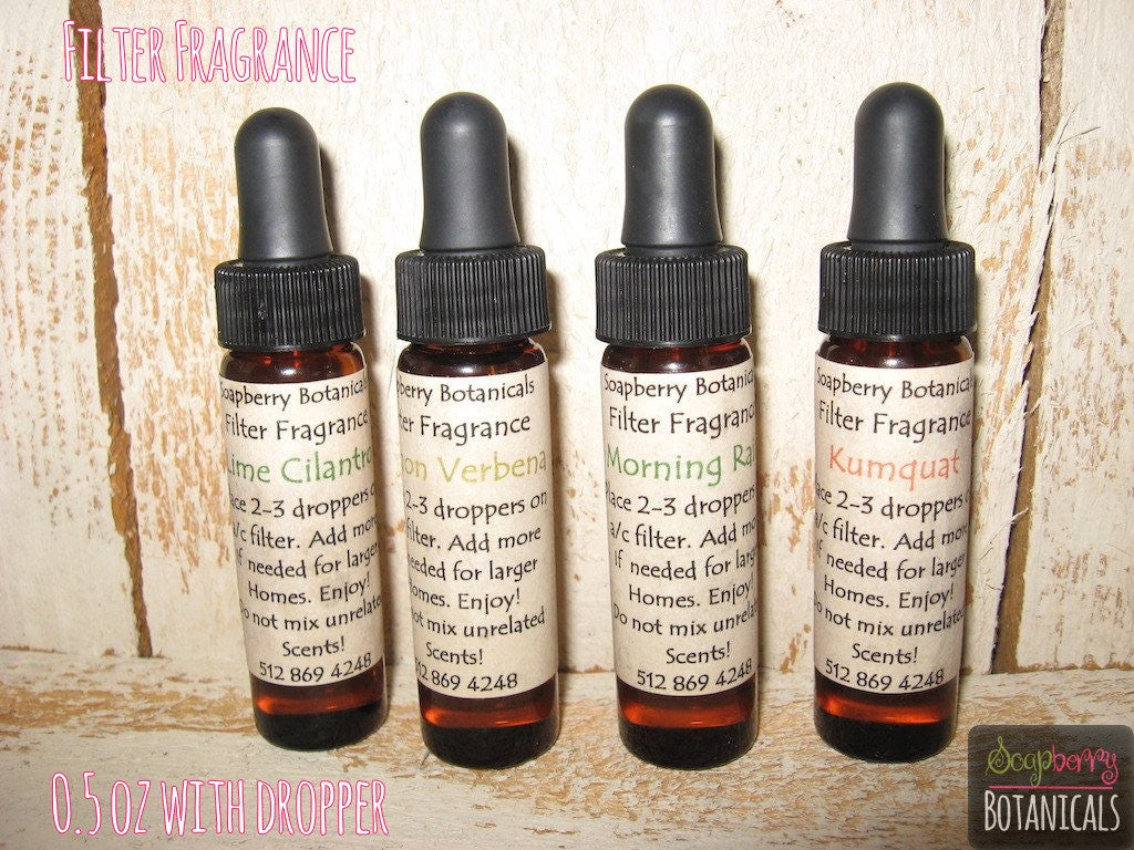 four half ounce filter fragrance bottles with droppers